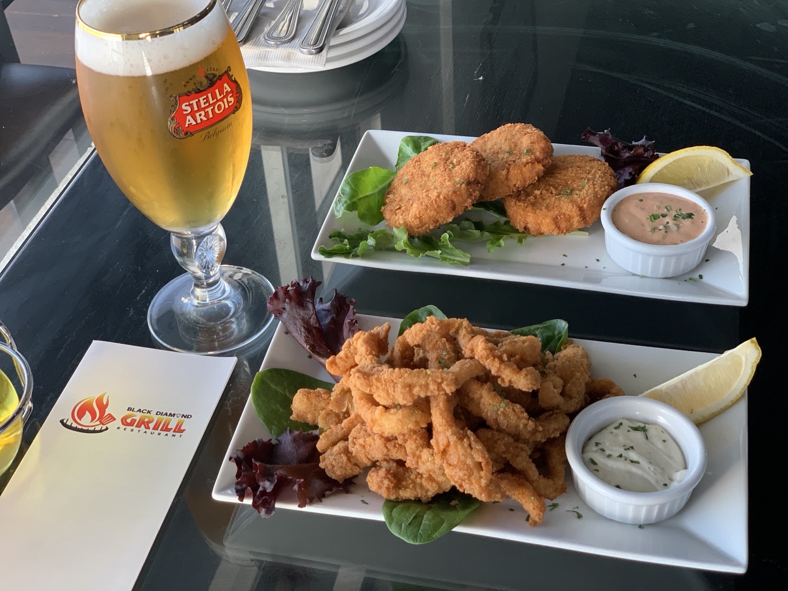 Crispy calamari and crab cakes with a draft beer