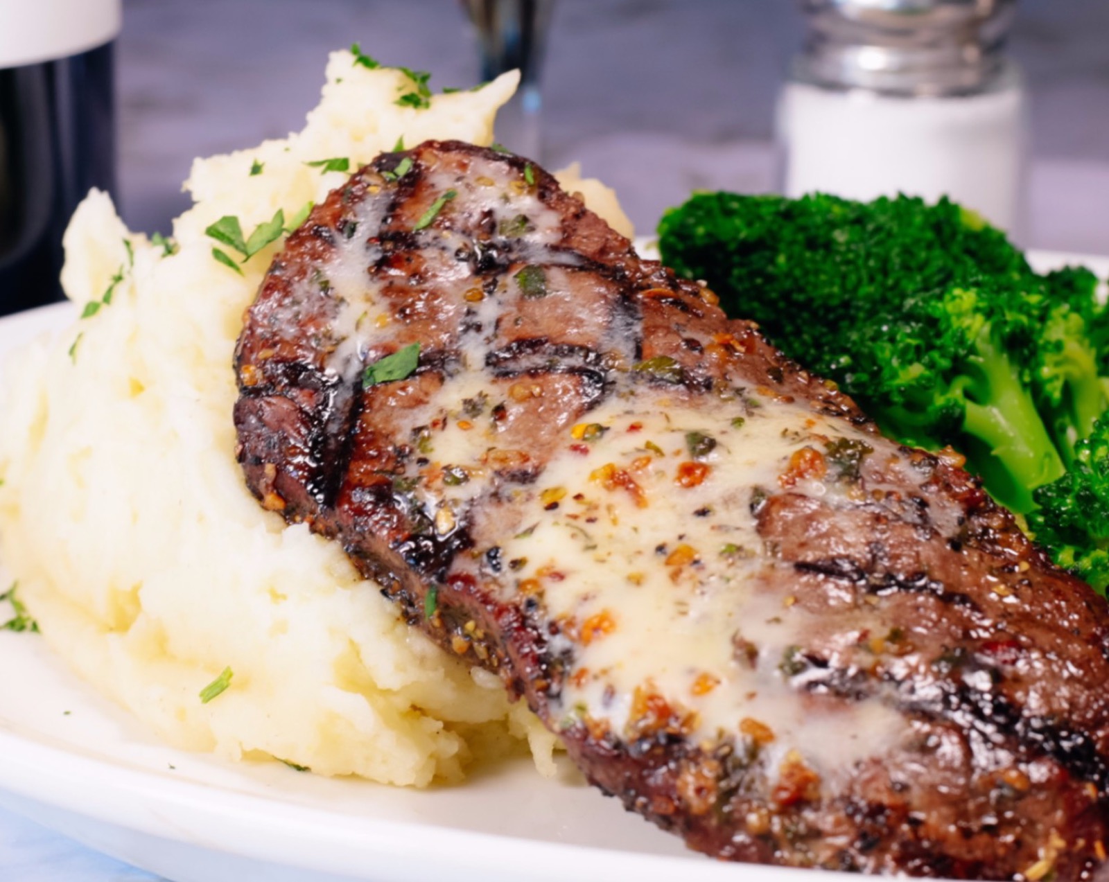 Grilled pork chop with mashed potatoes and broccoli