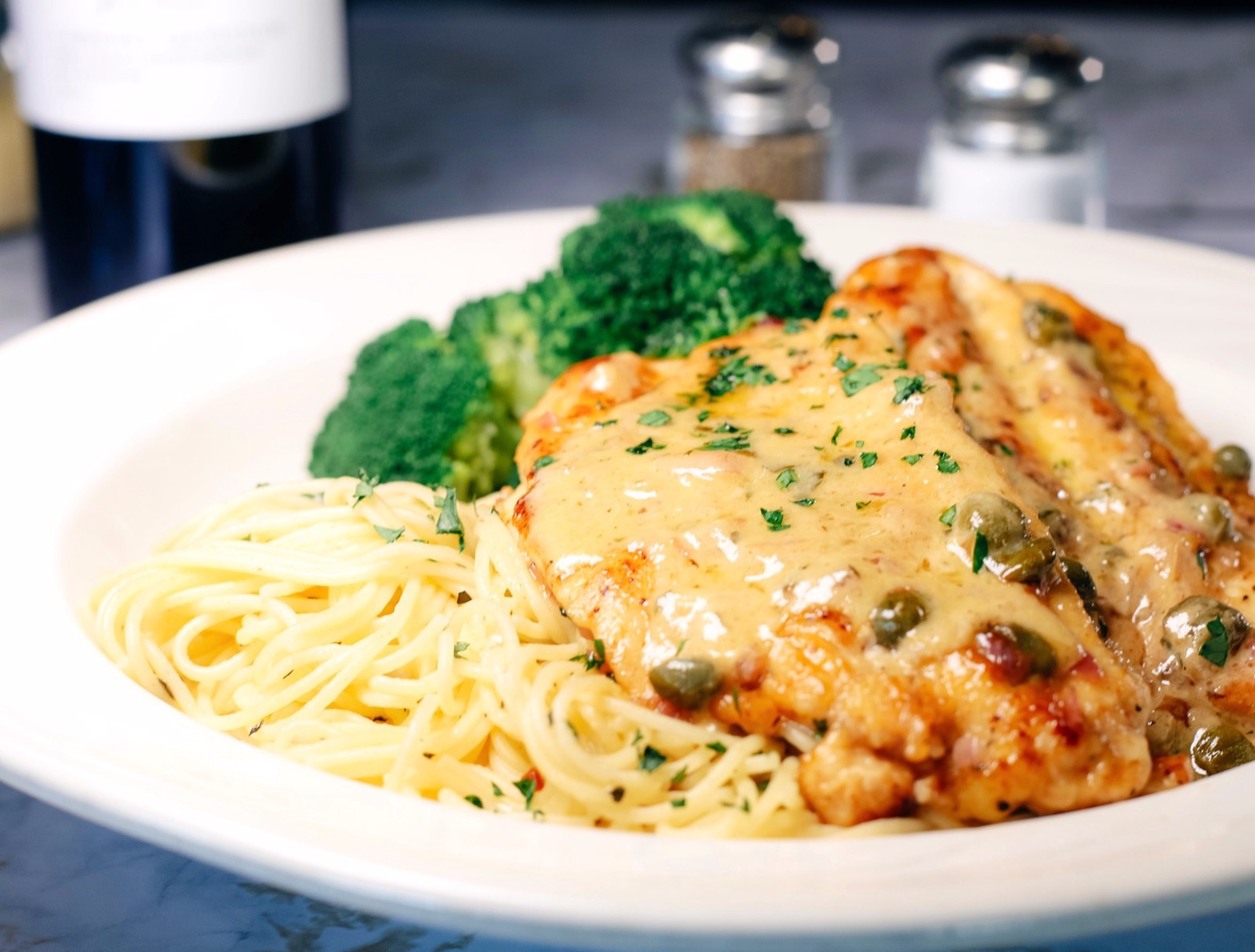 Chicken piccata over angel hair pasta